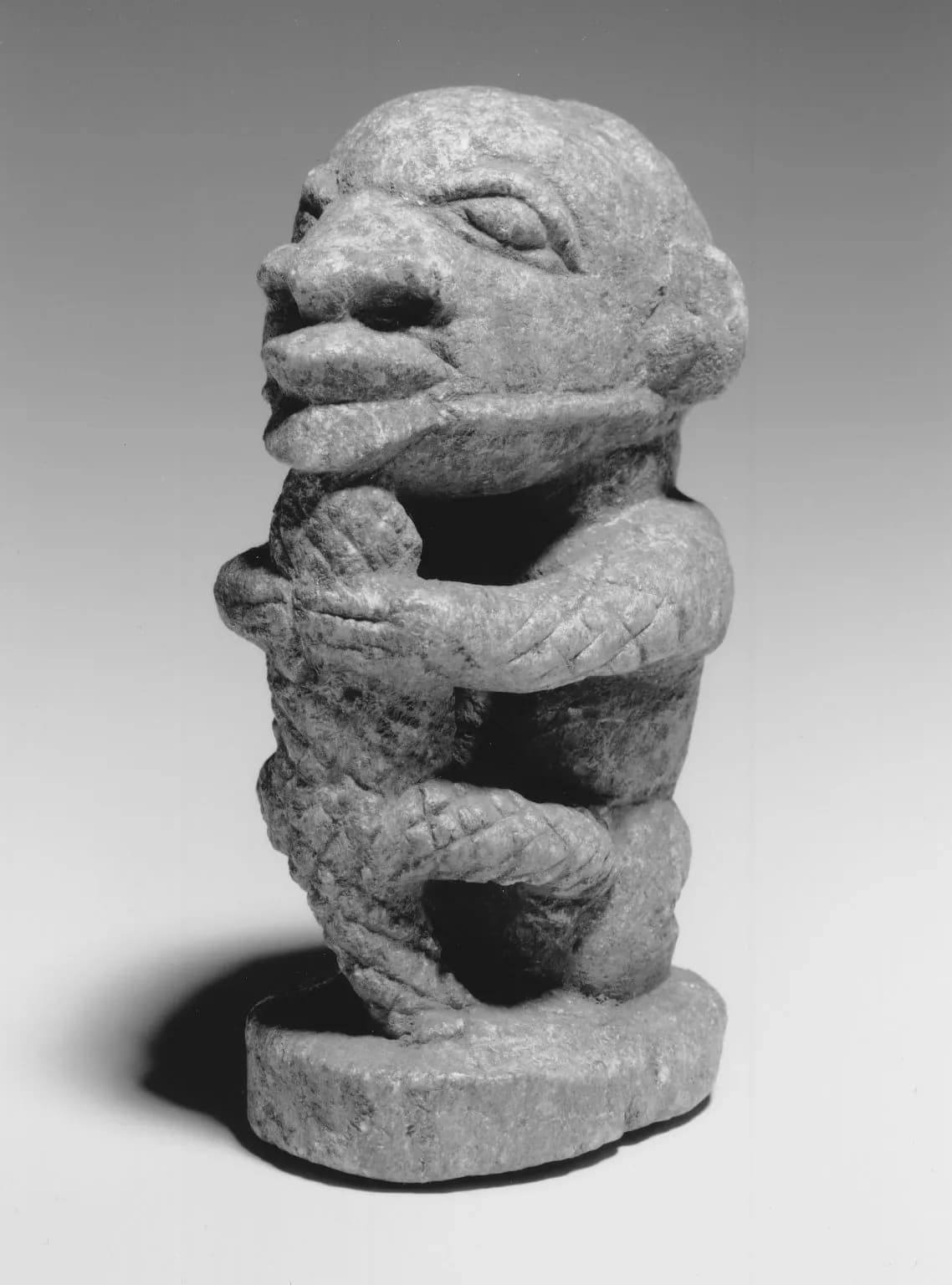 Figure of a Man Holding a Crocodile